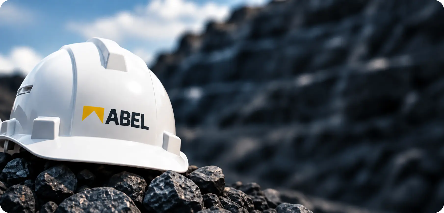 ABEL project helmet resting on a pile of coal